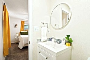Combined shower/tub, hair dryer, towels, soap