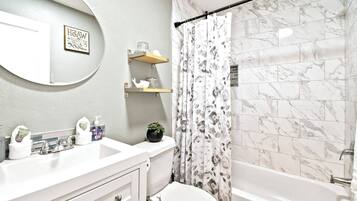 Combined shower/tub, hair dryer, towels, soap