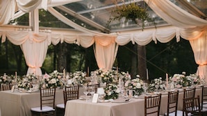 A tented outdoor dining area with tables set for a formal event, featuring draped fabric ceilings and floral centerpieces. - Castello Gubbio - Fifteen Bedroom Castle, Sleeps 30 (Gubbio)