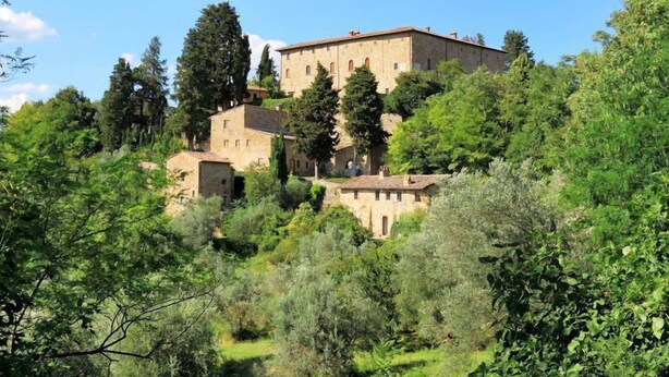 A historic building with multiple structures, surrounded by lush greenery and trees. - Casa Poggio - Four Bedroom Villa, Sleeps 12 (Cassia)