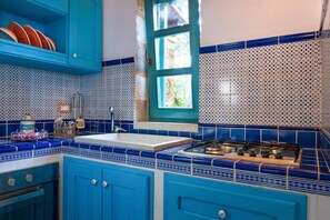 Microwave, oven, dishwasher, dining tables