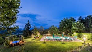 A pool area with lounge chairs and a hot tub, surrounded by a well-maintained lawn and trees. - San Veriano - Five Bedroom Villa, Sleeps 10 (Ripoli)