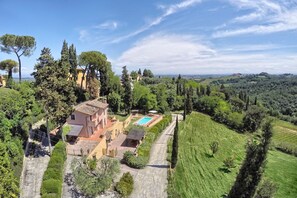 A villa with a swimming pool, surrounded by lush greenery and hills. - Villa Aprica - Five Bedroom Villa, Sleeps 10 (Pillo)