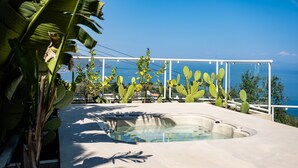 A hot tub with a clear view of the sea and mountains in the background. - Villa Naxos - Eight Bedroom Villa, Sleeps 18 (Taormina)