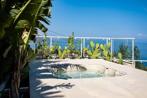 A hot tub with a clear view of the sea and mountains in the background. - Villa Naxos - Eight Bedroom Villa, Sleeps 18 (Taormina)