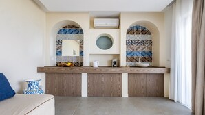A modern kitchen with a built-in oven, a coffee machine, and a sink. - Villa Naxos - Eight Bedroom Villa, Sleeps 18 (Taormina)