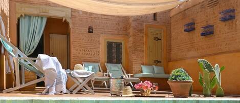 A heated pool, sun loungers