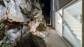 A modern building with a glass staircase leading to a landing. - Villa Dinara - Three Bedroom Villa, Sleeps 6 (Mimice)
