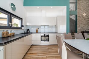 Dishwasher, highchair, dining tables