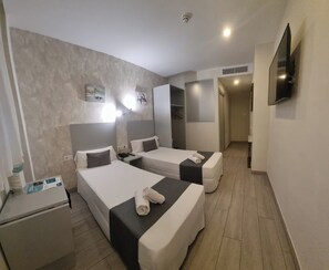 Economy Double or Twin Room, Ground Floor | Minibar, in-room safe, desk, blackout curtains