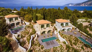A coastal property with three villas, each with a pool and outdoor seating. - Villa Drosoula - Two Bedroom Villa, Sleeps 4 (Fiskardo)
