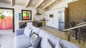 A modern kitchen with white cabinets, stainless steel appliances, and a wooden ceiling. - Cubo's Finca Las Palmeras / Private pool / Free Wifi (Alhaurin de la Torre)