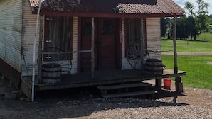 An old, weathered building with a sign that reads "MERCHANT CANTILE". - The Hideout @ Yellow Rose Canyon (Rusk County)
