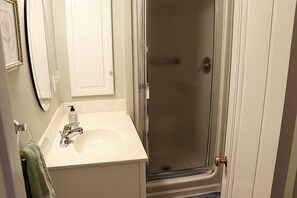 Combined shower/tub, hair dryer, towels, soap