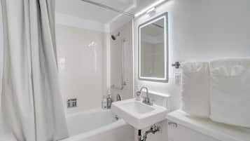 Combined shower/bathtub, hair dryer, towels, soap