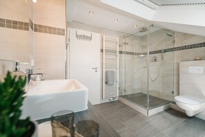Shower, hair dryer, towels, soap