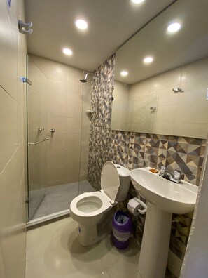 Shower, rainfall showerhead, hair dryer, towels