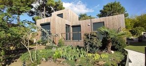 Stroll through the beautifully maintained garden to the entrance of this two-story building.