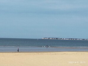 Enjoy a serene beach experience with a wide, open shoreline.