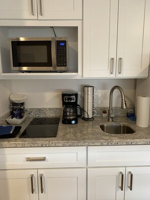 Fridge, microwave, stovetop, coffee/tea maker