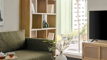 Apartment, 2 Bedrooms | Living room | 50-inch flat-screen TV with digital channels, TV, streaming services