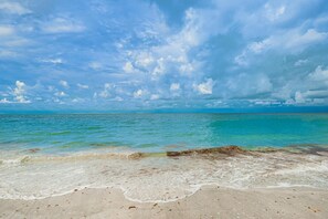 On the beach, sun-loungers, beach towels