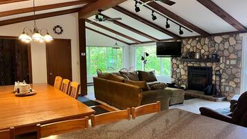 Smart TV, fireplace, books, computer monitors