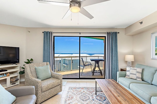 {LIVING ROOM}- Imagine yourself unwinding with good conversation and ocean views