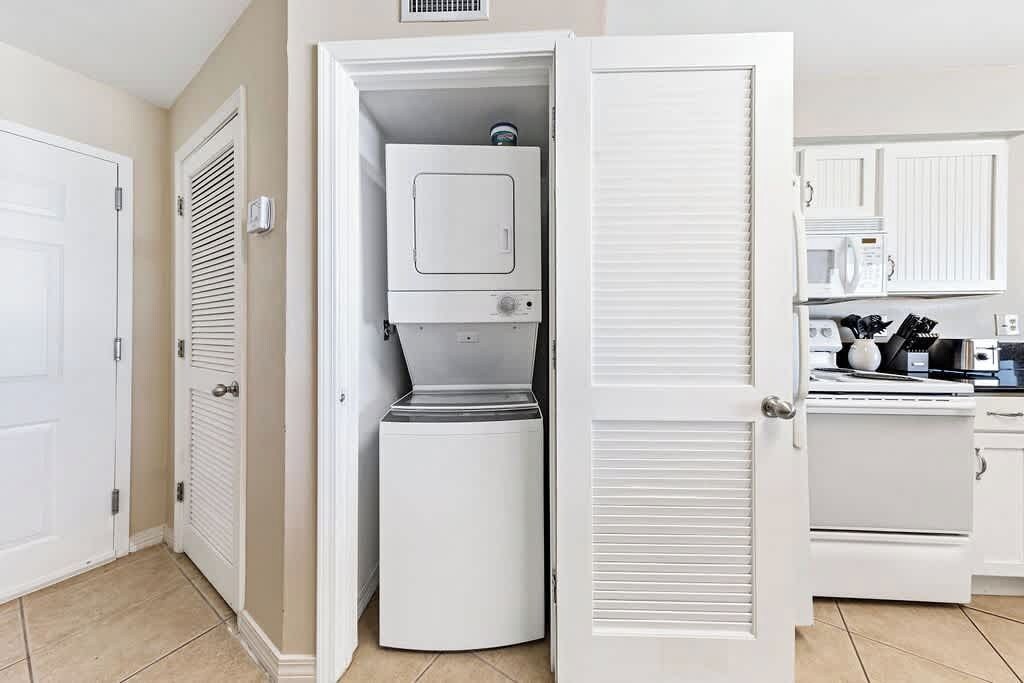 {KITCHEN} - stackable washer/dryer 
includes laundry detergent.