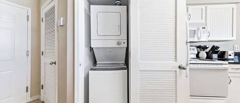 {KITCHEN} - stackable washer/dryer
includes laundry detergent.