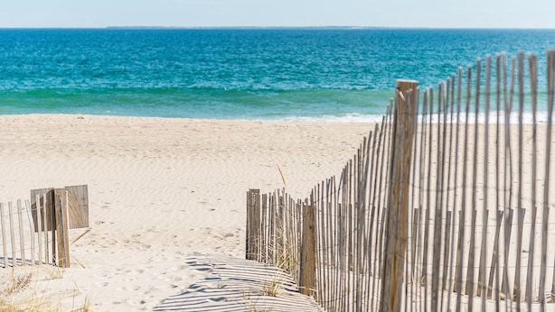 A beach with a wooden fence leading to the water. - Newly Renovated Quonnie Beach House -  QEBA Beach Pass & Pond Access (Charlestown)