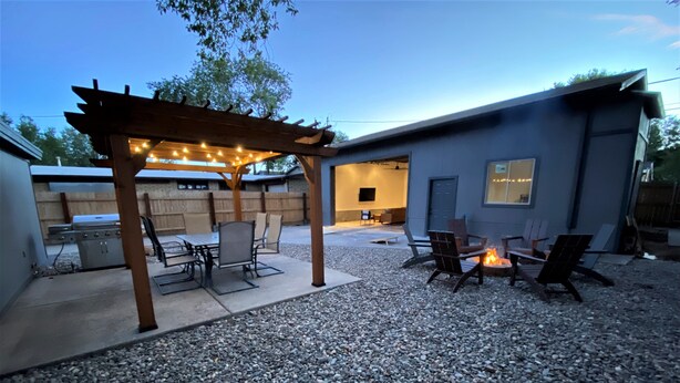 An outdoor patio with a pergola, seating, and a fire pit. - Explore like a local with access to everything Flagstaff has to offer (Flagstaff)