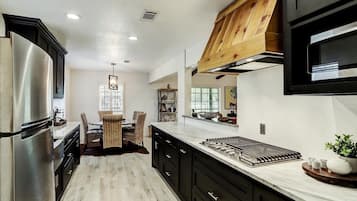 Fridge, microwave, stovetop, coffee/tea maker