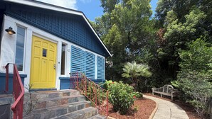 A house with a blue exterior, a yellow door, and a red staircase leading to the entrance. - Old Town "Gem", Near Historic Downtown Saint Augustine (St. Augustine)