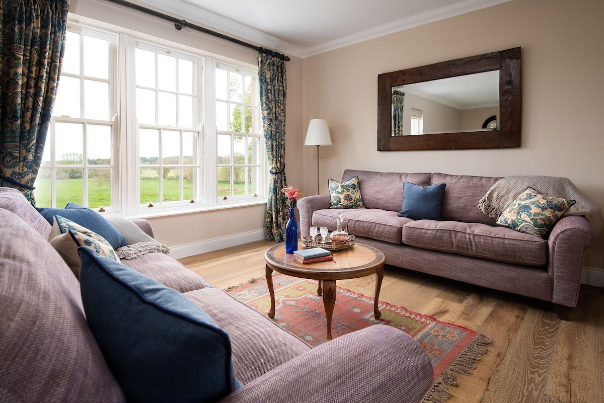Fairnington East Wing - large triple window in the sitting room with views across rolling countryside