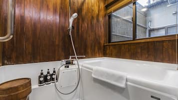 City Townhome | Bathroom | Combined shower/tub, hair dryer, electronic bidet, towels