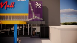 A modern building with a 'Yes Hotel' sign and a 'Mall' sign.