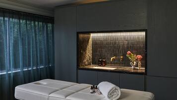 Relax in a serene space with a cushioned bench and storage cabinet.