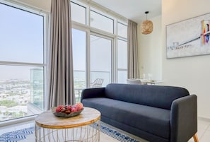 Deluxe Apartment | Living area | 55-inch Smart TV with cable channels, TV