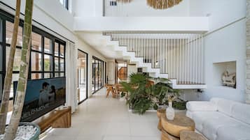 Villa | Living area | 55-inch TV with cable channels