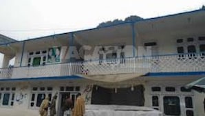 A multi-story building with a balcony on the second floor. - Frontier Hotel (Balakot)