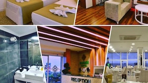 Quarto de hotel com duas camas, área de recepção, banheiro e sala de jantar.
