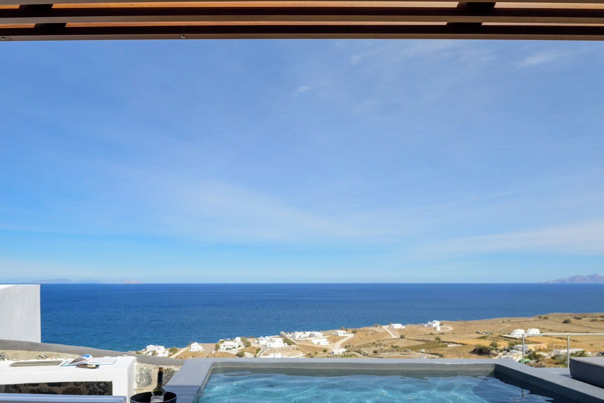 A pool with a clear view of the sea and distant land.