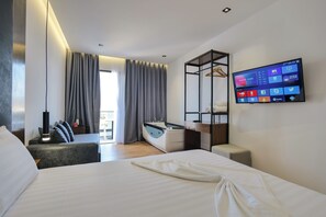 Suite, bañera de hidromasaje | Ropa de cama