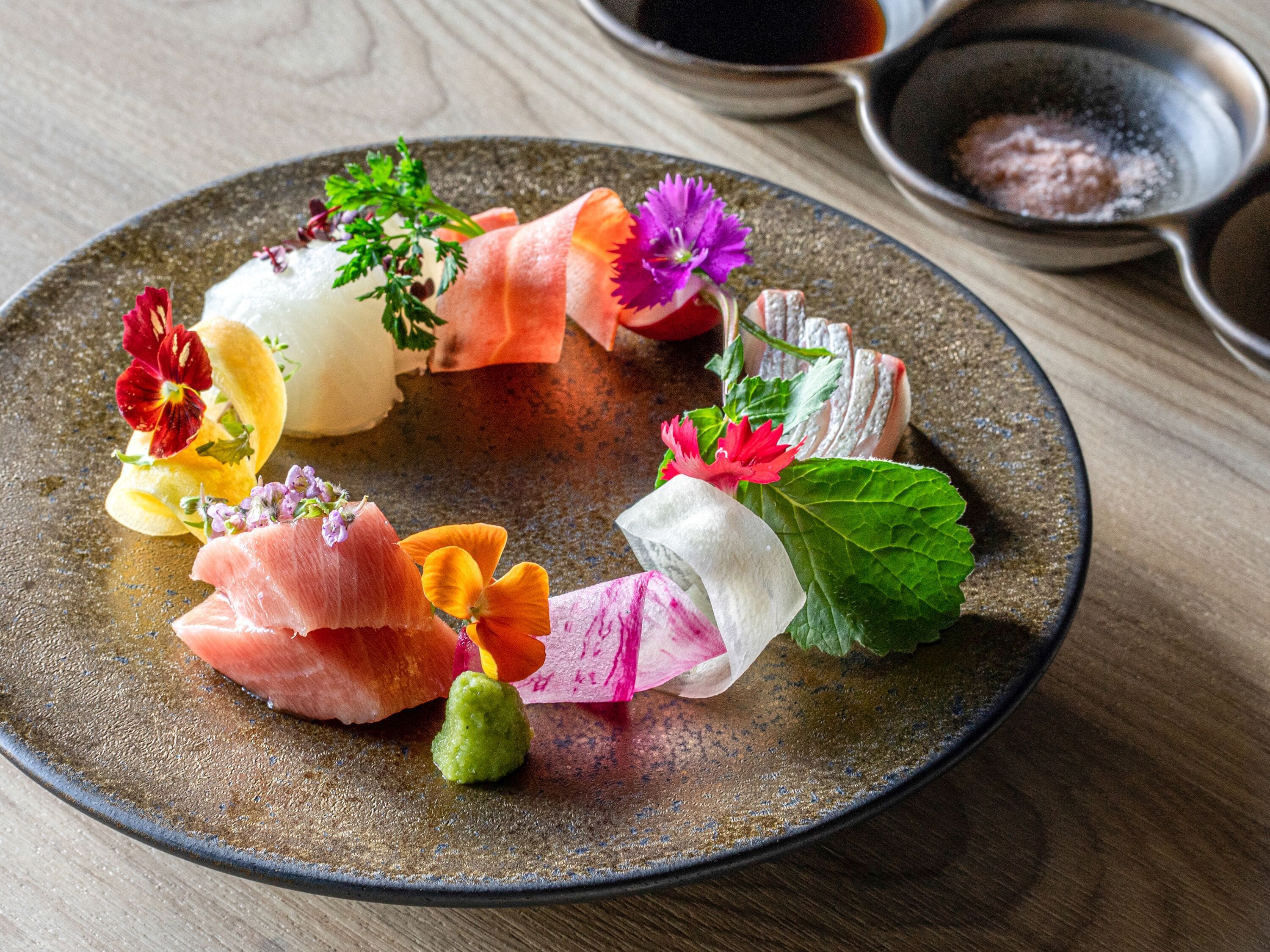 A plate with various food items and garnishes.