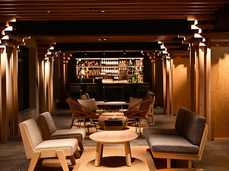 A bar area with wooden furniture and a well-lit interior.