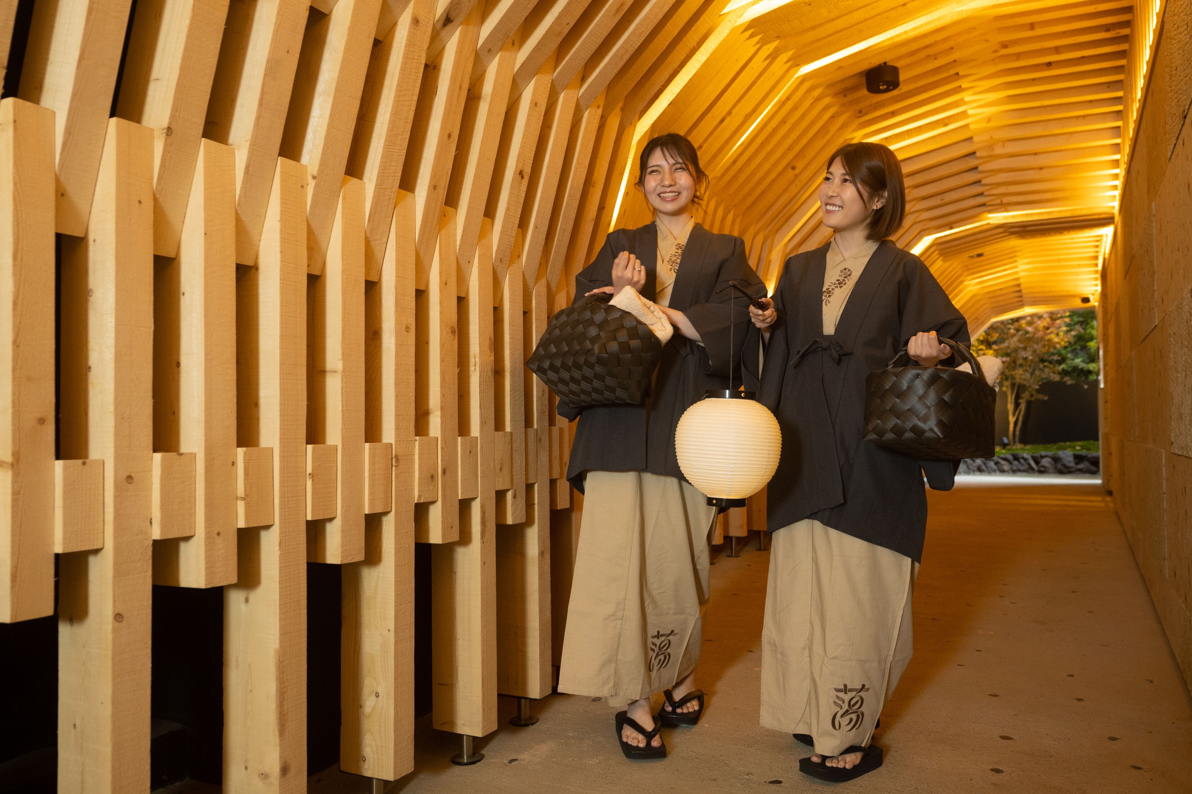 A wooden structure with a curved ceiling and a corridor.