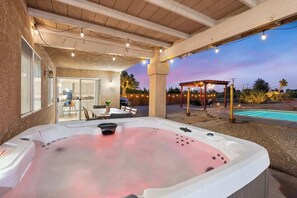 An outdoor hot tub area with a covered patio, a pool, and a gazebo. - Joshua Tree 5BR Getaway w/ Heated Pool & Hot Tub! (Yucca Valley)