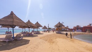 A beach with thatched umbrellas and sun loungers. - MG Alexander The Great (Marsa Alam)