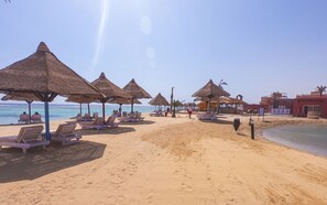 On the beach, sun-loungers, beach umbrellas, beach towels - MG Alexander The Great (Marsa Alam)